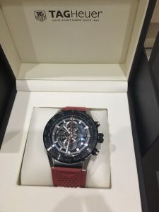 The ceramic fake watches have red rubber straps.