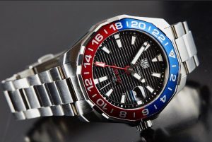 The black dials replica watches have red and blue bezels.